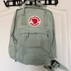 Mint green Fjallraven mini backpack.